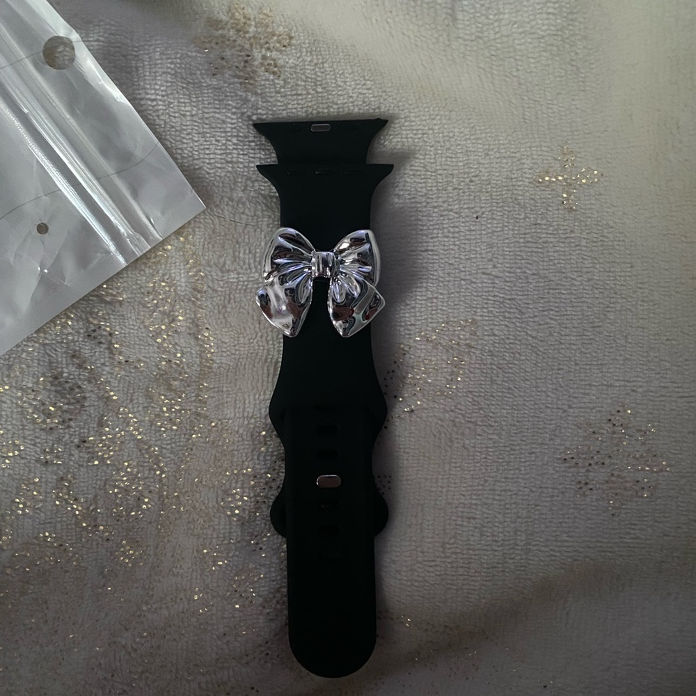 apple watch band black with silver bow, 44mm, not sure on brand.